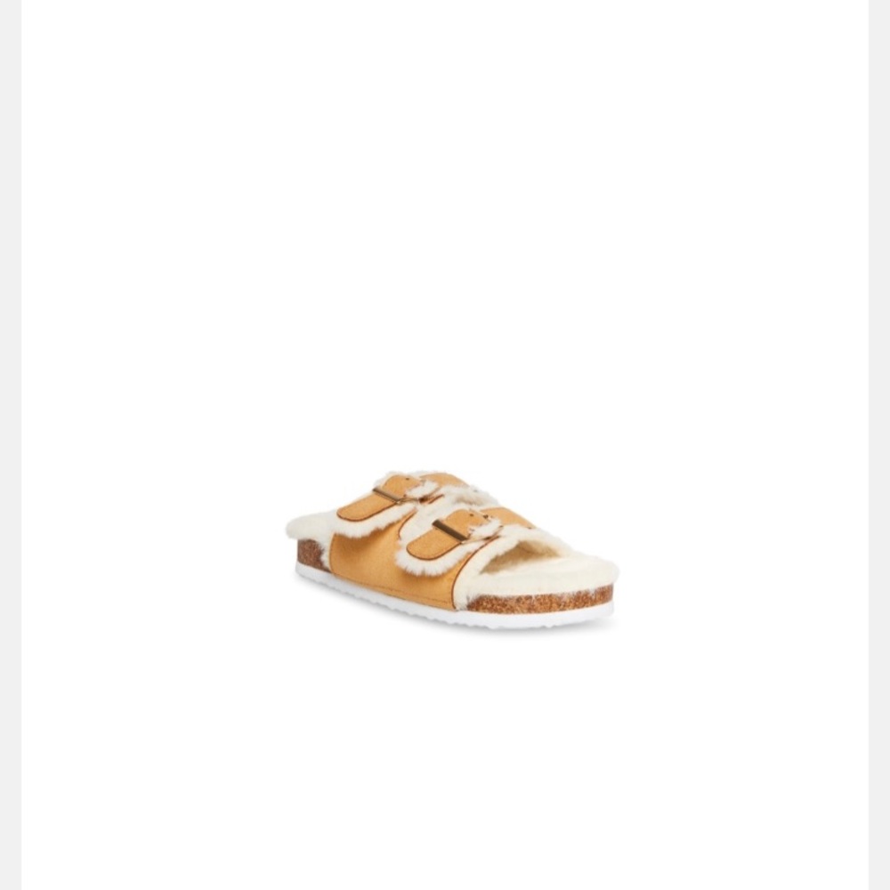 Tan faux fur slide in sandals made by Steve Madden